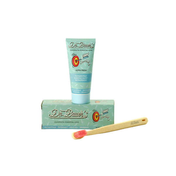Dr. Bauer's Zahnpasta Essential Love Alpen Fresh 50ml und Bambuszahnbürste mit roten Borsten - für Karies-Schutz und langanhaltende Frische.