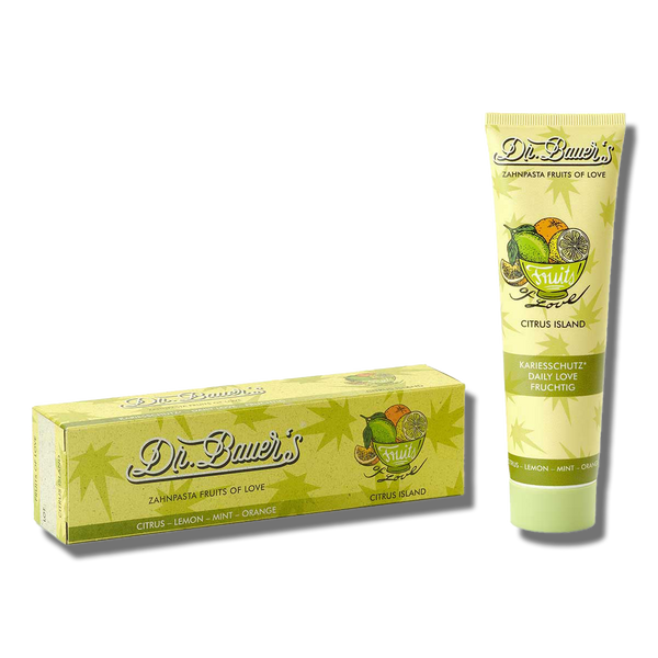 Dr. Bauer's Zahnpasta Fruits of Love Citrus Island 90ml mit natürlichen Inhaltsstoffen zeigt Früchte und Blätter auf Tube und Box – ideal für die tägliche Anwendung.