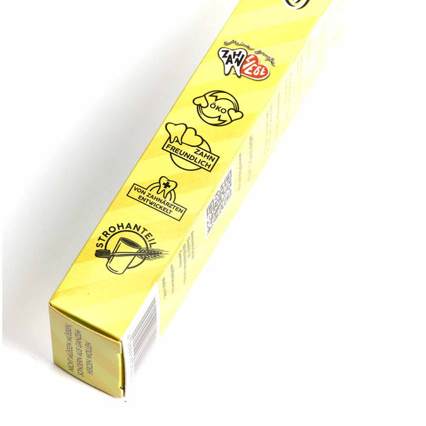 Dr. Bauer's Daily Love Zahnbürste medium von Dr. Bauer's: Gelbe Box mit schwarzen Icons zeigt umwelt- und zahnfreundliche Eigenschaften. Biobasierte Borsten - ideal für nachhaltige Zahnpflege-Fans.