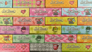16 rechteckige Dr. Bauer’s Zahnpastaverpackungen in einem gleichmäßigen 4×4-Raster. Jede Verpackung hat einen Pastell-Hintergrund, einen Geschmacksnamen (z. B. ‚Smile of Love‘, ‚Active Love‘, ‚Lovely Friends‘, ‚Fruits of Love‘) und ein zugehöriges Symbol (Herz, Lippen, Früchte, Einhorn).