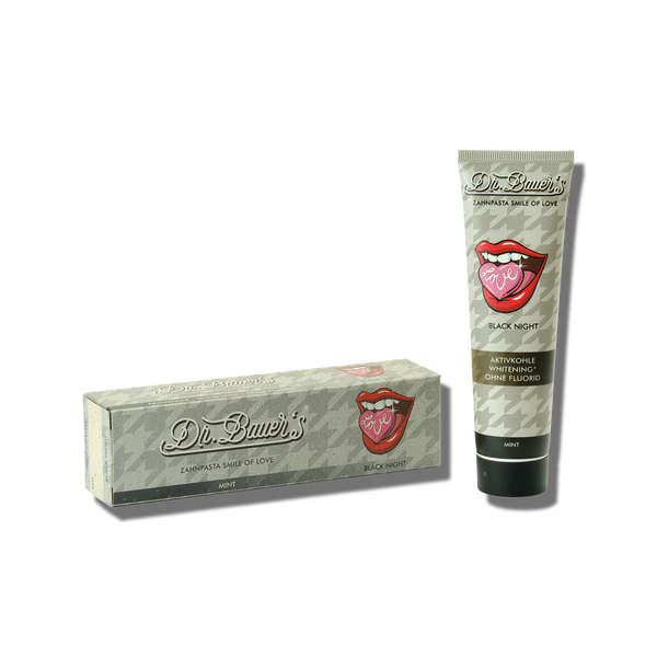 Tube und Schachtel Dr. Bauer's Zahnpasta Smile of Love Black Night 90 ml mit Lippengrafik, Hahnentrittmuster und Hervorhebung der sanften Reinigung für eine sanfte und dennoch effektive Reinigung.