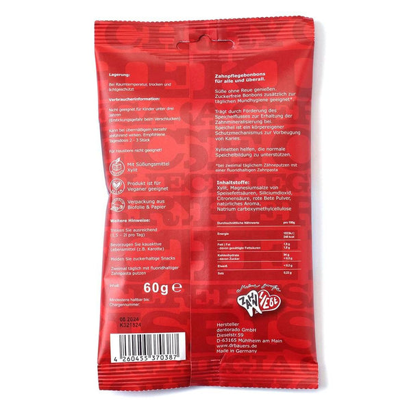 Dr. Bauer's Xylinetten Kirsche 60g: Rote Verpackung mit deutschem Text, Kirschgeschmack, Nährwertangaben und Informationen zur Zahngesundheit auf der Rückseite. Marke: Dr. Bauer's.