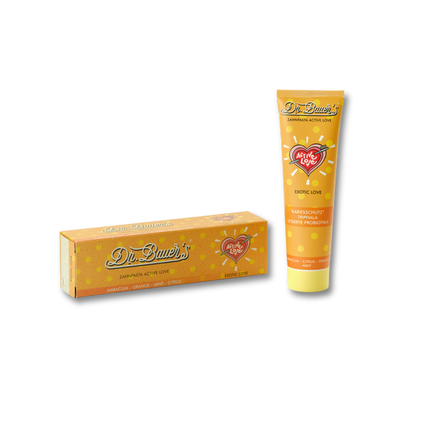Dr. Bauer's Zahnpasta Active Love Exotic Love 90ml - tropische Zahnpflege in Tube und Box mit orange-gelbem Herzdesign auf schwarzem Hintergrund, von Dr. Bauer's.