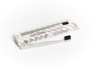 Eine Dr. Bauer's Daily Love Zahnbürste medium mit biobasierten Borsten steht vor ihrer Box, ideal für nachhaltige Zahnpflege.