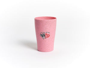 Dr. Bauer's Zahnputzbecher Stroh 4er Packung: Rosa gesprenkelter Becher von Dr. Bauer's, aus einem Strohhalm-Kunststoff-Mix mit Zahn- und NYC 2023-Grafik auf weißem Hintergrund.