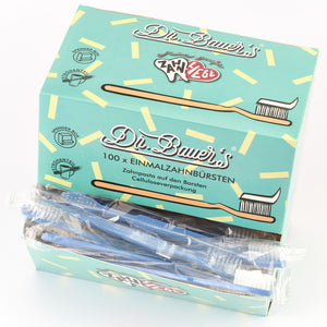 Box mit 100 Dr. Bauer's Einmalzahnbürsten -STROH- in blauer Verpackung, einzeln verpackt und mit integrierter Zahnpasta.