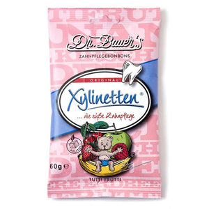 Dr. Bauers Xylinetten Tutti Frutti 60g präsentieren sich in einer rosa Packung mit Bären-Illustration und fruchtigen Bonbons, die sich durch ihren Xylit-Gehalt ideal zur Zahnpflege eignen.