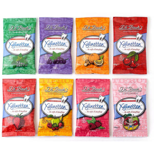 Acht Beutel Dr. Bauer’s Xylinetten Himbeere 60g sind in zwei Reihen angeordnet.